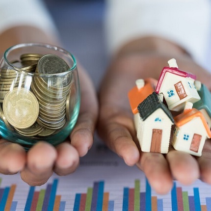 2 hands with houses and coins_canstockphoto67626473-2